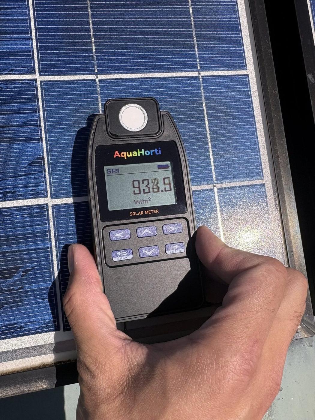 Wisconsin State Capitol panel after cleaning — 933.9 W/m² irradiance reading