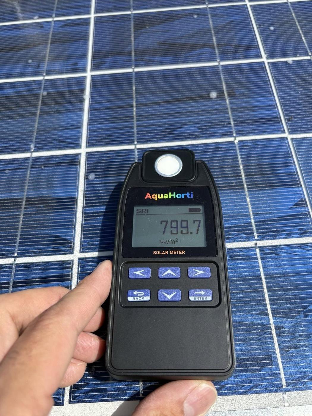 Wisconsin State Capitol panel before cleaning — 799.7 W/m² irradiance reading