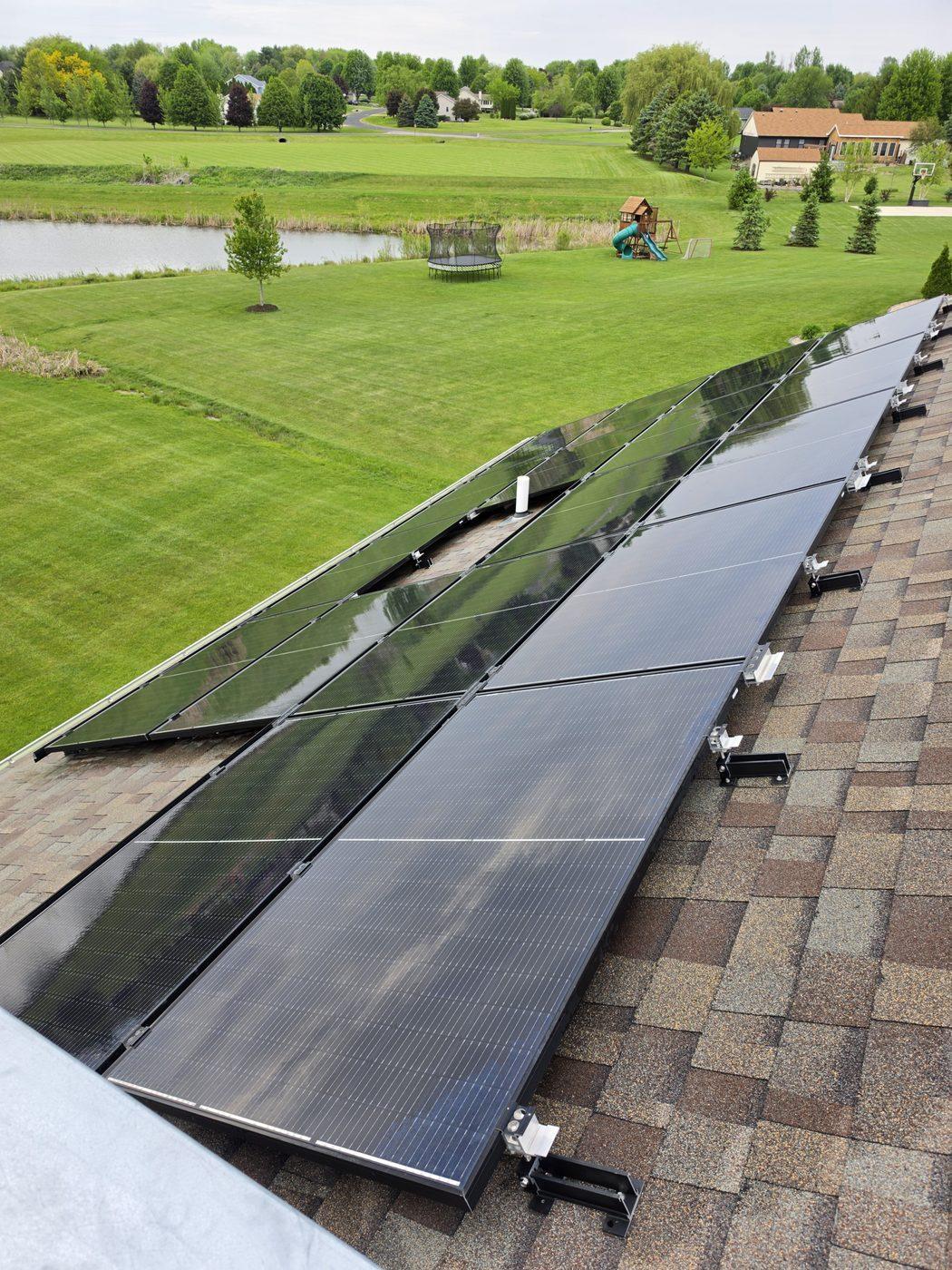 Solar panels after professional cleaning on overcast day — mirror clean