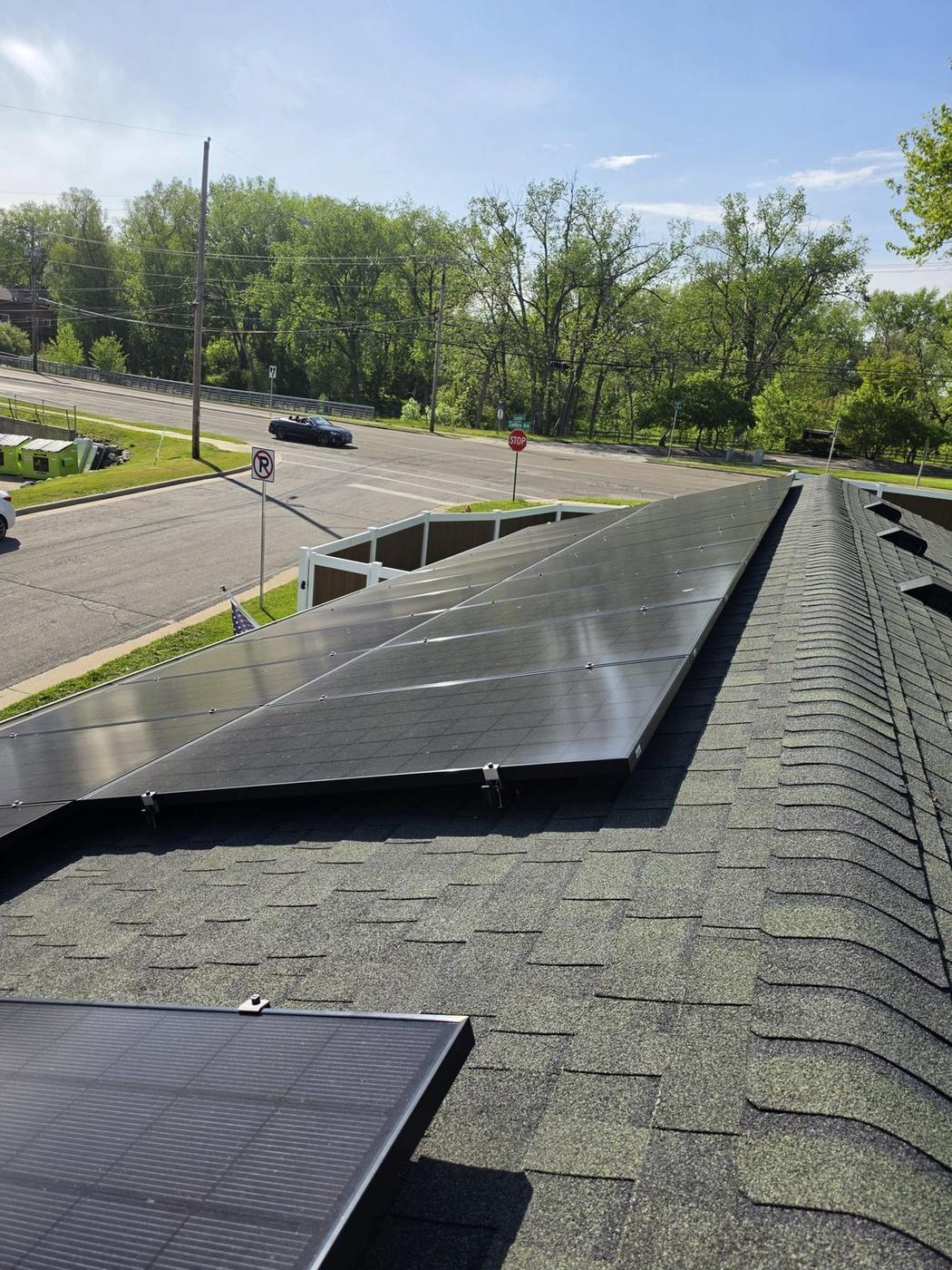 Southern Wisconsin residential solar array before cleaning — dull and hazy