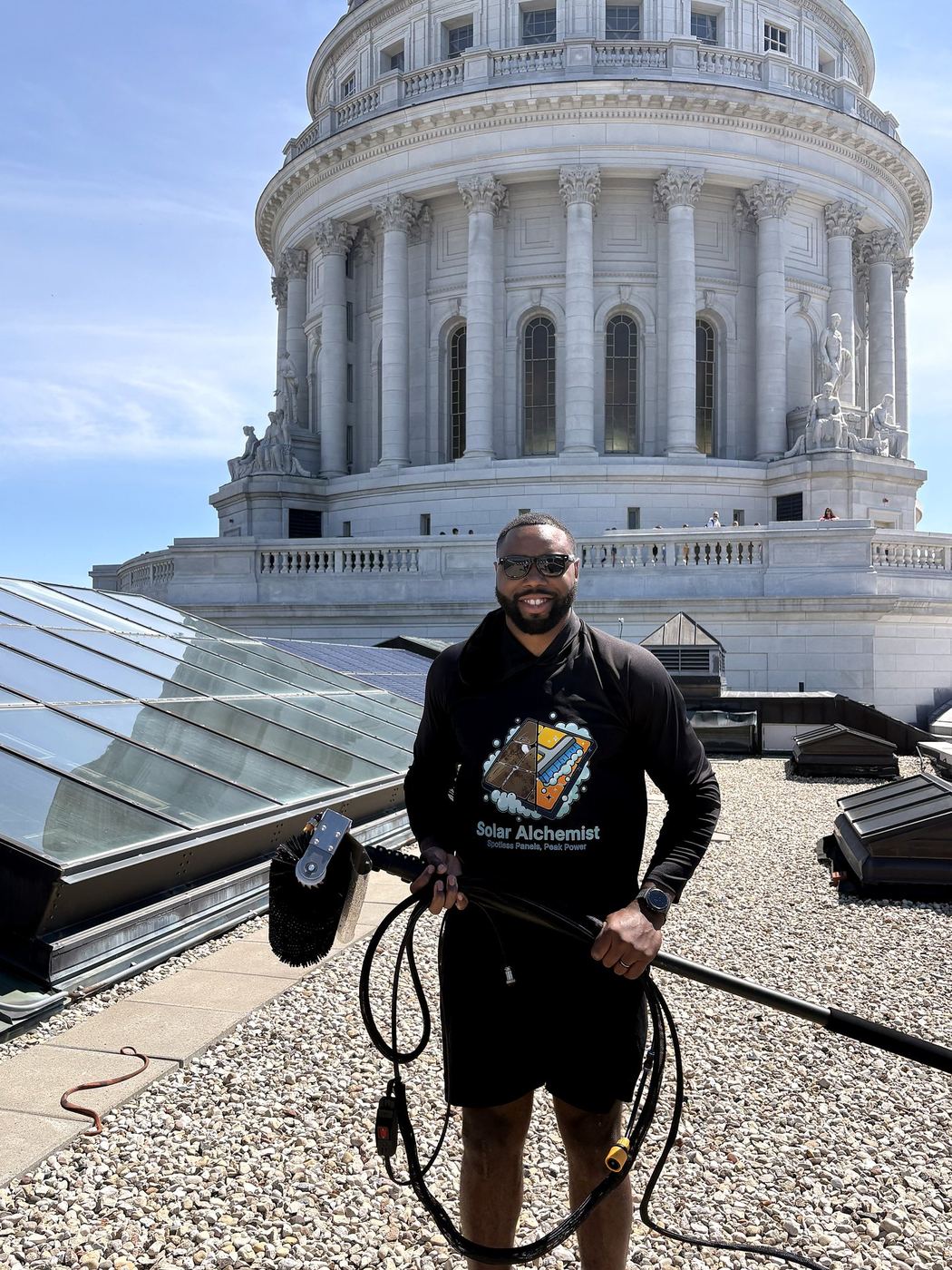 Marquis Mason on the Wisconsin State Capitol rooftop — Founder of Solar Alchemist